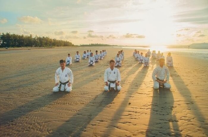 a group of people practising karate